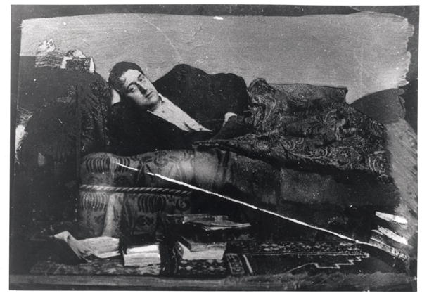 Portrait of Guillaume Apollinaire (1880-1918) reclining, c.1910 (b/w photo)  from French Photographer
