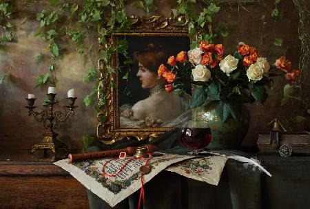 Still life with flowers and picture