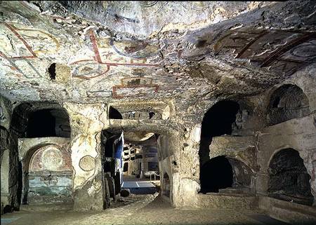 Interior of a catacomb chamber cut from tufa stone showing fragments of frescoed decoration from Anonymous painter