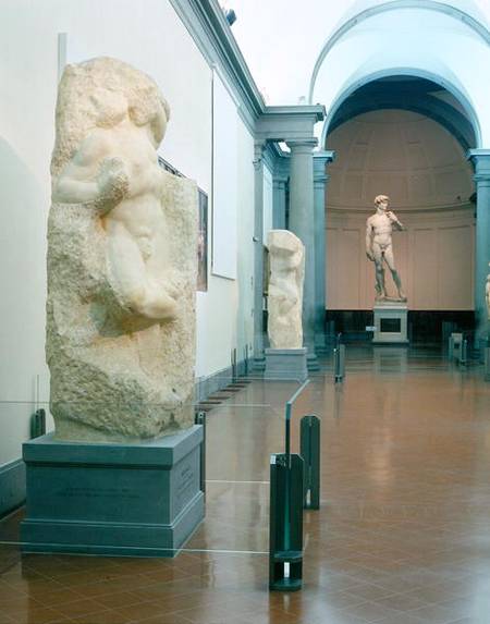 Interior view of the gallery with Michelangelo's 'Awakening Slave' and 'David' in the background (ph from Anonymous painter