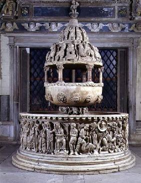 Font in the form of a fountain covered by a tempietto and with carved reliefs depicting the Story of