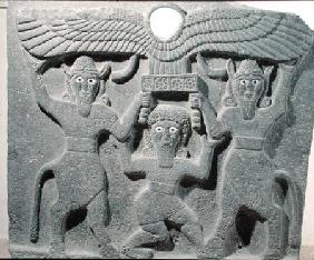 Relief depicting Gilgamesh between two bull-men supporting a winged sun disk, from Tell-Halaf, Syria