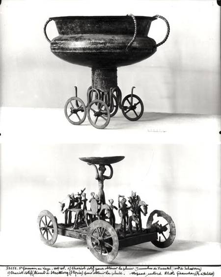 Two votive chariots for collecting rainwater: Top - cup supported on four wheels from the Peccatel t from Bronze  Age