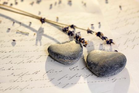 Stone hearts on old letter