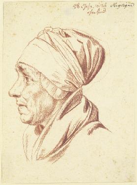 Kopf einer älteren Frau mit Kopftuch im Profil nach links