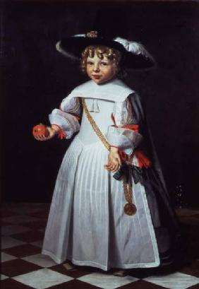 Portrait of a young child holding an orange