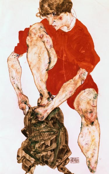 Female model in a fiery red jacket and trousers from Egon Schiele