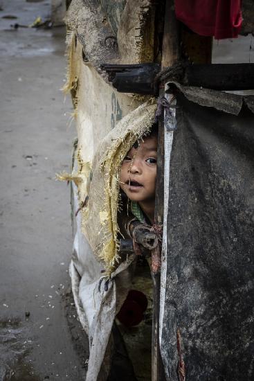 sheltering from the rain in the outskirts of Kolkata