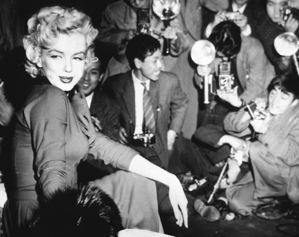 Marilyn Monroe surronded by photographers from English Photographer, (20th century)