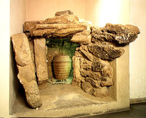 Reconstruction of an Etruscan tomb with an urn (stone) from Etruscan