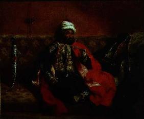 A Turk smoking sitting on a sofa