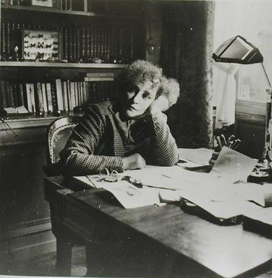 Portrait of Sidonie Gabrielle Colette (1873-1954), in her study (b/w photo) from French School, (20th century)