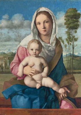 Madonna mit Kind in einer Landschaft.