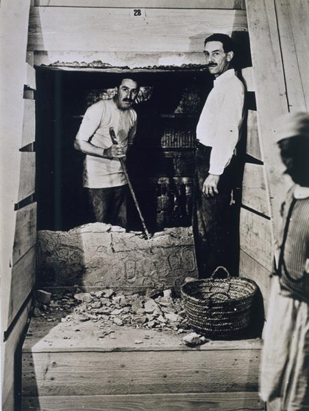 Howard Carter (1873-1939) and a colleague standing beside a partially demolished wall to one of the  from Harry Burton