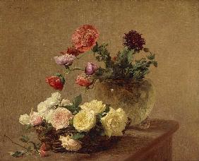 Flowers into glass vase and basket with roses