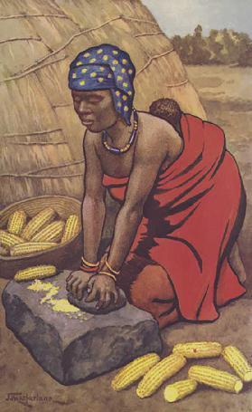 Woman grinding mealies