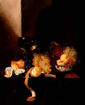 A Still Life with Fruit, a Peeled Lemon and a Roemer on a Ledge