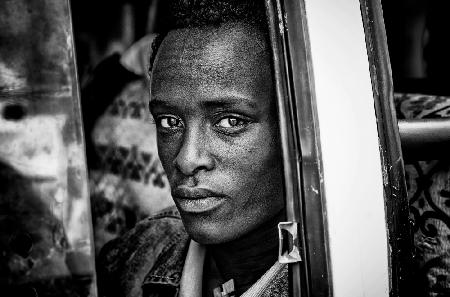 Ethipian man looking throught the bus´ window