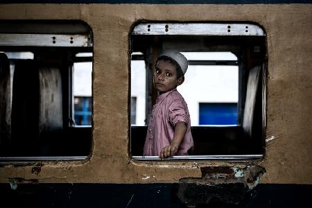 Boy alone in a train carriage - Bangladesh