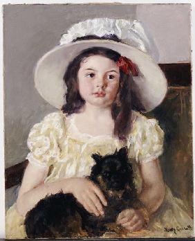 Françoise mit einem kleinen schwarzen Hund