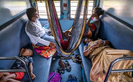 An Indian family travelling by train