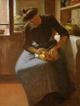 Woman polishing a Kettle
