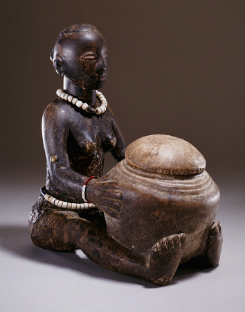 A Luba Figure Of A Seated Female Holding A Round Bowl from 