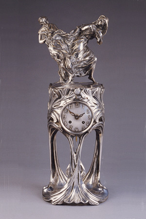 An Art Nouveau Silver-Patinated Bronze Clock Cast From Models By Maurice Dufrene (1876-1955) And Vou from 