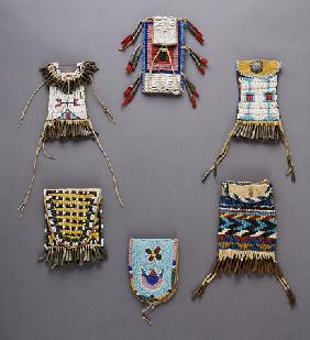 An Assortment Of Kiowa, Sioux, Cheyenne, Crow, And Apache Beaded Hide Belt Pouches