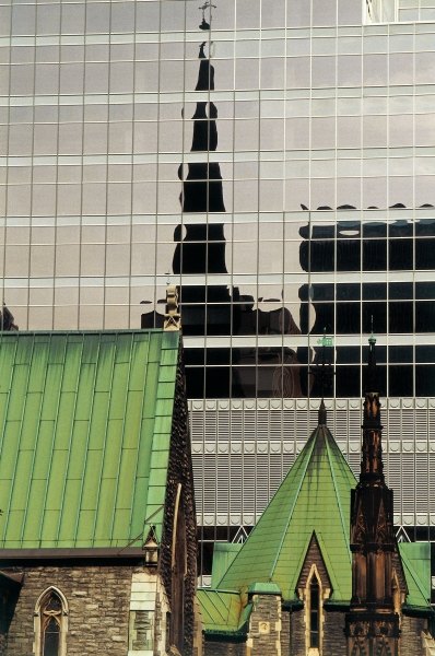 Green roofs and church reflected in glass panels (photo)  from 