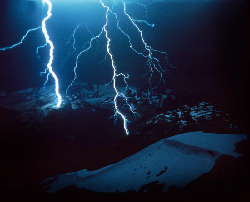 Lightning during a storm over snowy mountains from 