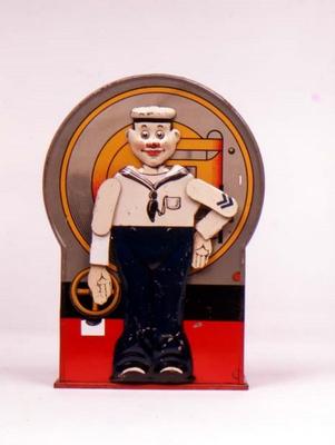 Tin Mechanical bank in form of a sailor. When the lever is depressed, he stands to attention and sal from 