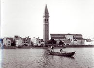 View of the church of San Martino on the island of Burano from the lagoon (b/w photo)