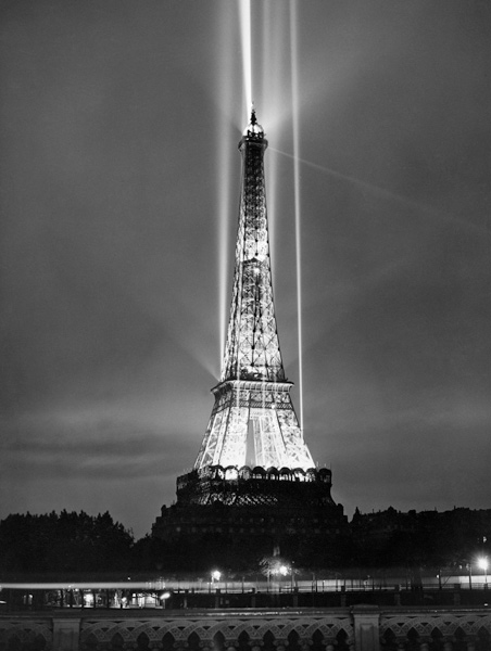 World fair in Paris: illumination of the Eiffel Tower by night from 