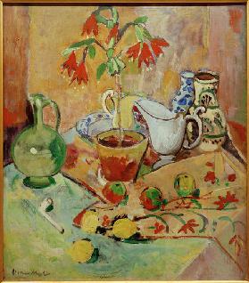 Still life with potted plant and pitchers, fruits and whistle