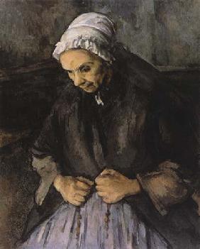 Old woman with rosary.