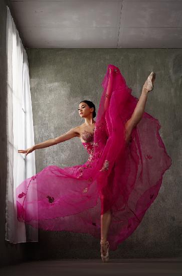 The pose of red gown ballerina