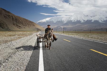 By donkey on the Karakorum Highway