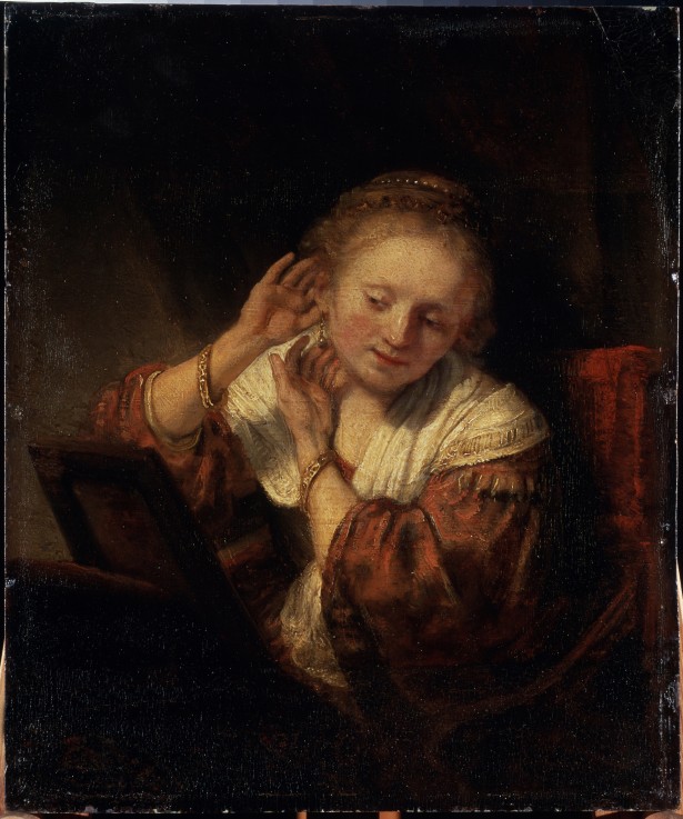 Young Woman trying on Earrings from Rembrandt van Rijn