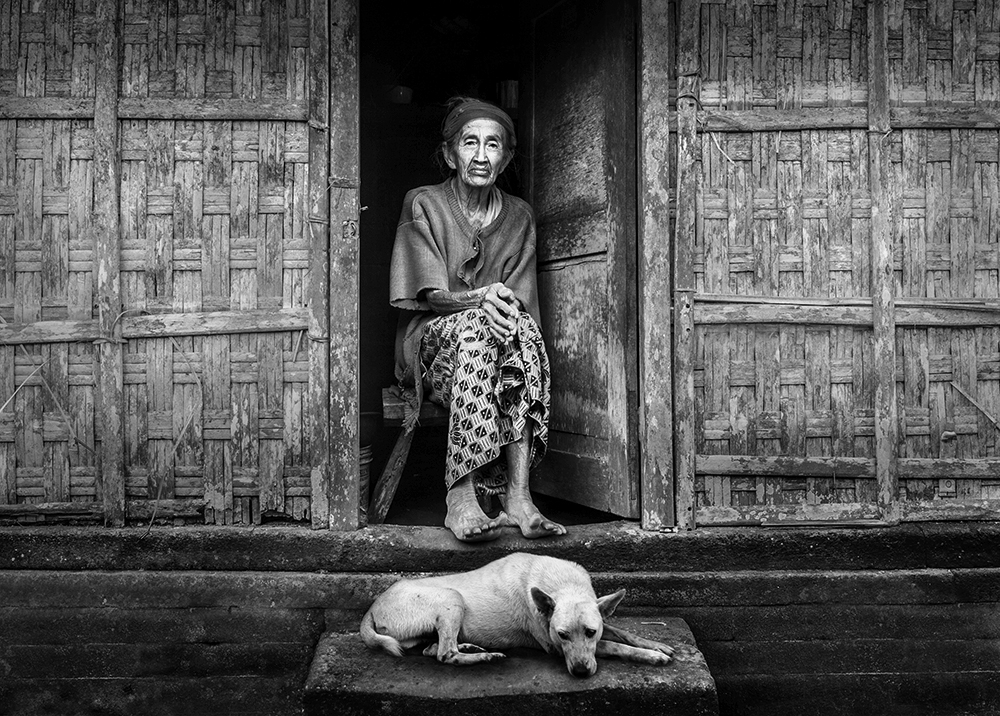 Old lady, her old dog and her old house from Sebastian Kisworo