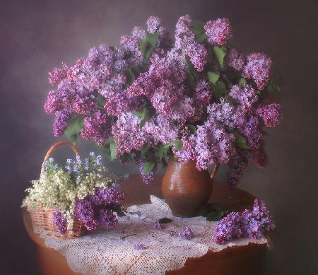 Spring still life with lilacs and lilies of the valley