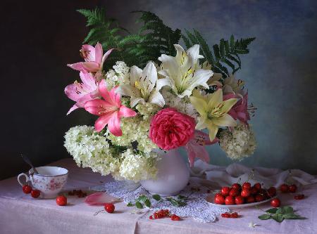 Still life with garden flowers and berries