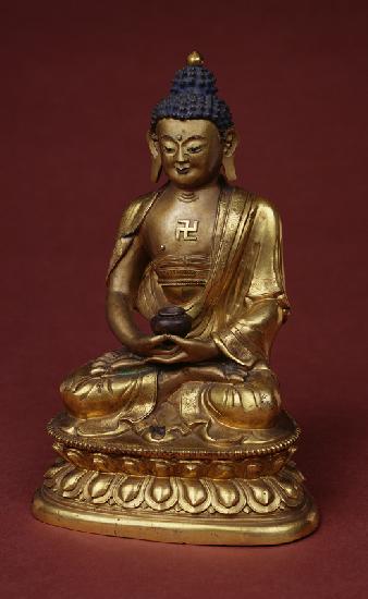 Buddha Amitayus seated in meditation holding the vase of nectar (amrta) in his lap