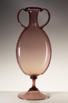Pink glass amphora with notched edging worked using pliers