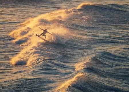 Surfing at Sunrise，