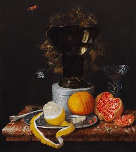 A Still Life with a Glass and Fruit on a Ledge