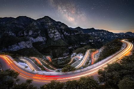 Footwall mountain road under the starry sky